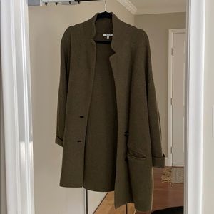 Too large. Worn a few times. Some peeling.